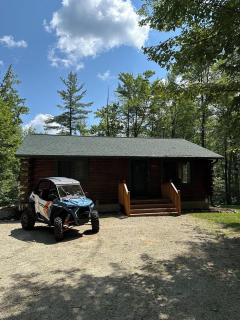 Our lovely cabin with the UTV.