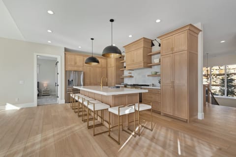 A fully equipped chefs kitchen with high end appliances and accessories