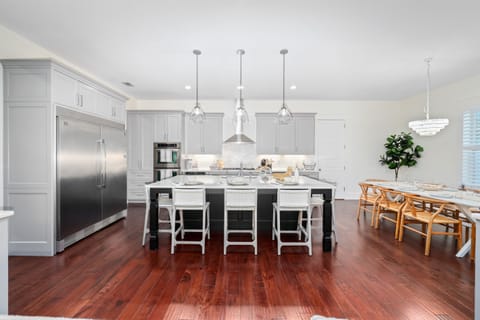 Fully stocked chef's kitchen with island seating