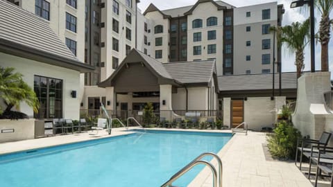Dive into sunlit relaxation at the sparkling resort-style pool.