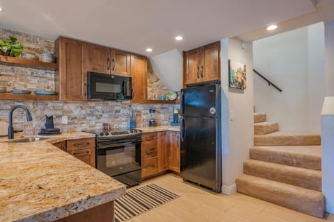 Beautifully restored kitchen with Keurig coffee maker, blender, and toaster.