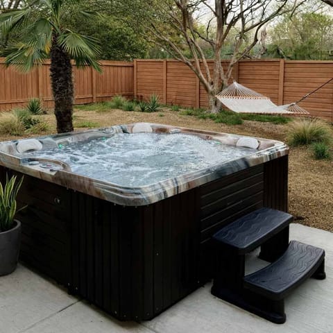 Relax in this 6 person hot tub in your private backyard.