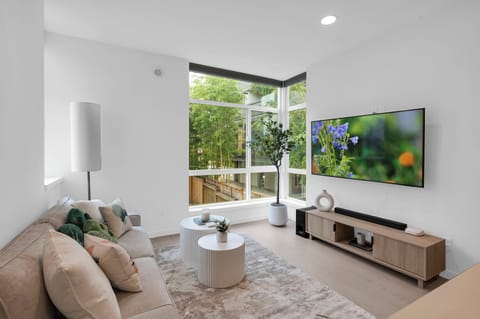Open living room with 65" Samsung smart TV