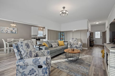 Cozy living room with light changing bookcase.