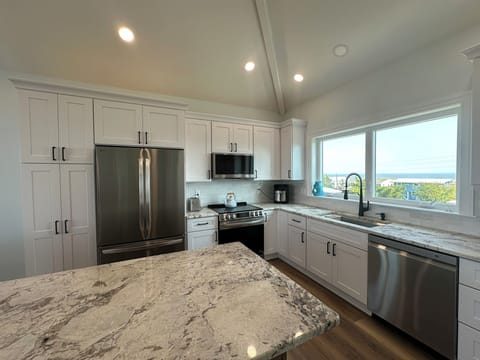 Fully equipped kitchen with sink overlooking the bay