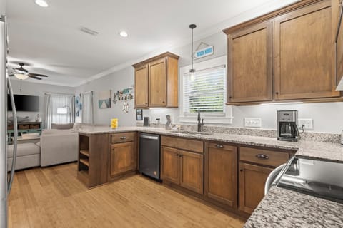 Kitchen - Stainless appliances are featured in the spacious kitchen, and offers a great space for preparing meals during your stay.
