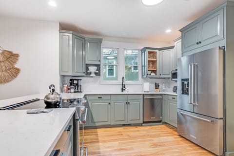 All new Kitchen Aide appliances, quartz countertops and a fully stocked kitchen!