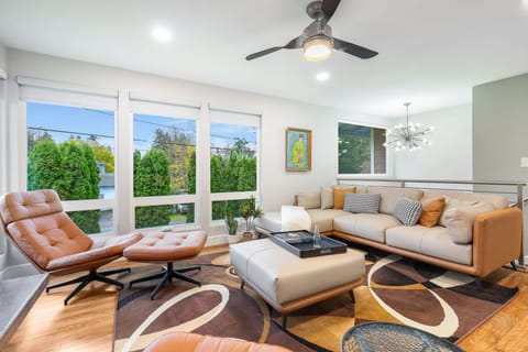 Spacious living room flooded with natural light. Relax with friends or curl up solo in this bright, inviting space.