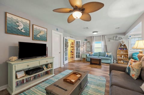 Bright living area with ample seating and Smart TV