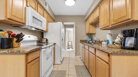 The kitchen offers ample space & all the comforts of home