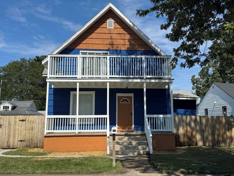 Front of house; Entrance to upstairs unit
