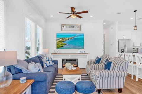 Coastal-Inspired Living Room | Comfy Seating + Smart TV Bright, beachy, and full of charm — relax in this nautical-style lounge with plush seating, ocean hues, and a smart TV for movie nights.