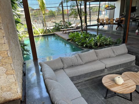 Living room, pool and main dining room