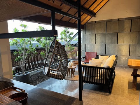 Third-floor open-air patio with living area