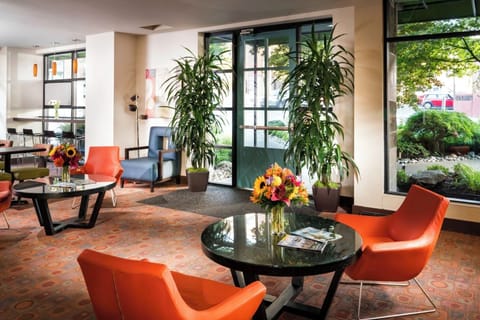 Settle in with coffee among stylish seating and lush greenery.