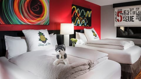 Stretch out on crisp linens beneath bold, playful art