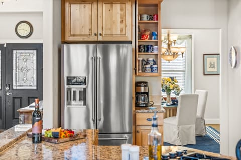 Top of the line kitchen with stainless steel appliances and granite countertops.