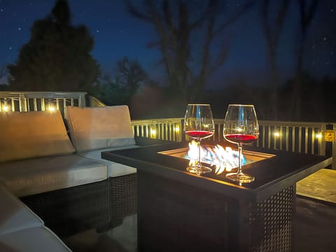 End your day here — glass in hand, fire dancing and nothing but peace all around