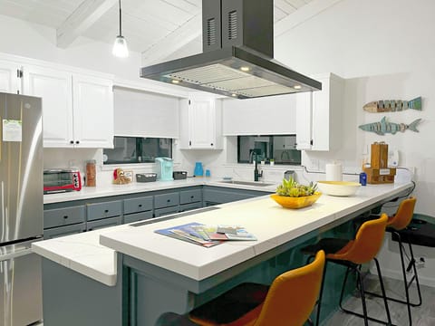 Cook with ease in this stylish kitchen with bar seating and full appliances.