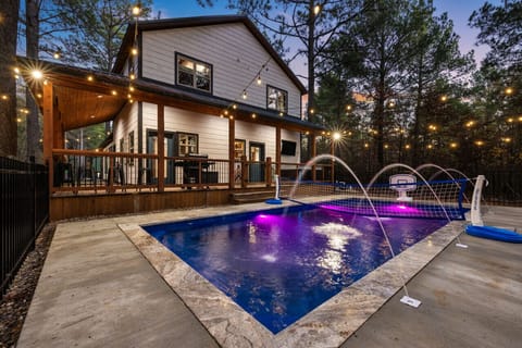 A glowing pool under string lights, perfect for evening swims.