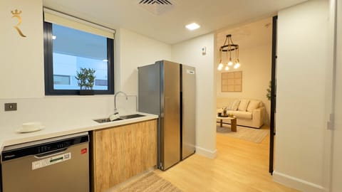 Experience the joy of cooking in a sleek and stylish kitchen that combines luxury finishes with every essential at your fingertips.