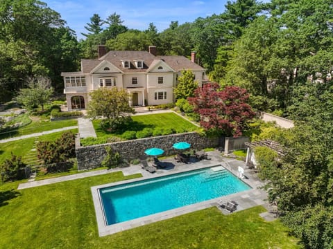 Experience the perfect family getaway in this luxurious estate with a private pool, spacious lawn, and elegant interiors designed for comfort and style. Kids can explore the garden while parents relax poolside or gather in the grand living spaces.