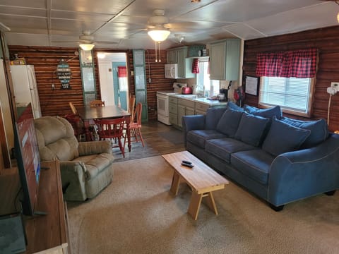 LIVING ROOM: Large and comfy living room with a sofa, comfy chair, coffee table, and streaming television.