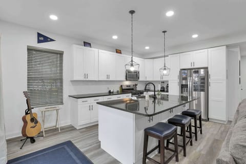The fully equipped kitchen is open to the living room and dining area, making it easy to cook, entertain, and stay connected. It offers everything you need to prepare meals, from cookware to modern appliances.