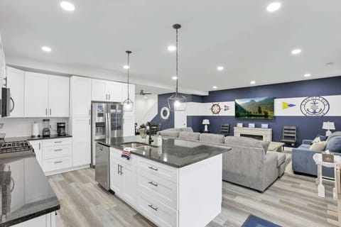 The kitchen opens directly to the living room area, creating a spacious, connected layout that's perfect for cooking, relaxing, and spending time together.