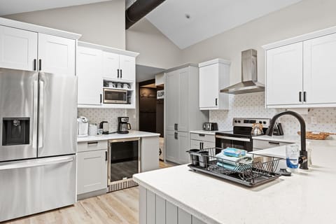 Chef’s Dream Kitchen
A sleek and fully stocked kitchen with high-end appliances, crisp white cabinetry, and a spacious island, making cooking and entertaining effortless.