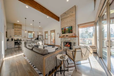 Bright living area with cozy seating and TV