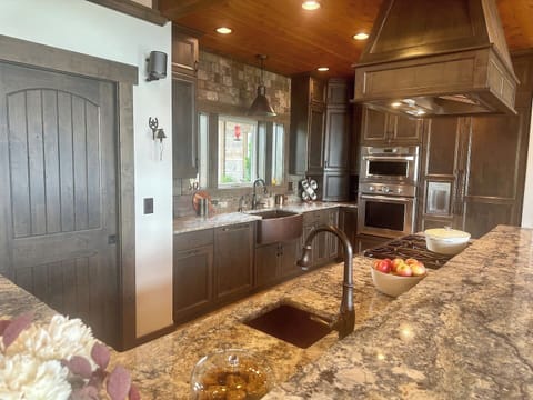 This spacious kitchen with walk-in pantry invites you to prepare meals you and your family and friends can enjoy together.