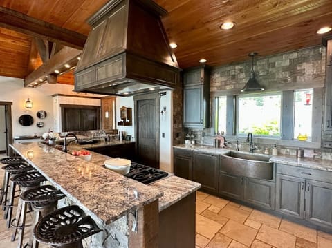 The kitchen opens up to the living and dining areas.