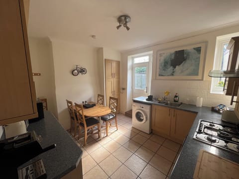 Kitchen / Dining Table, Oven, Stove, Toaster, Microwave, Kettle, Fridge, Freezer