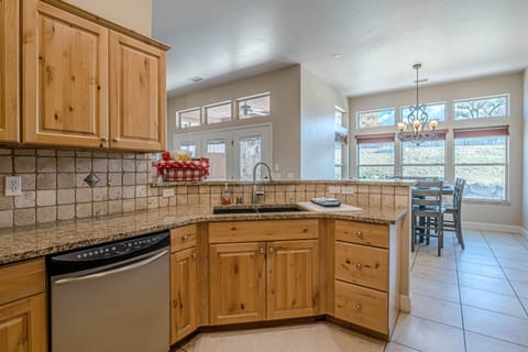 With stunning stone tile flooring throughout, this space feels both elegant and inviting.