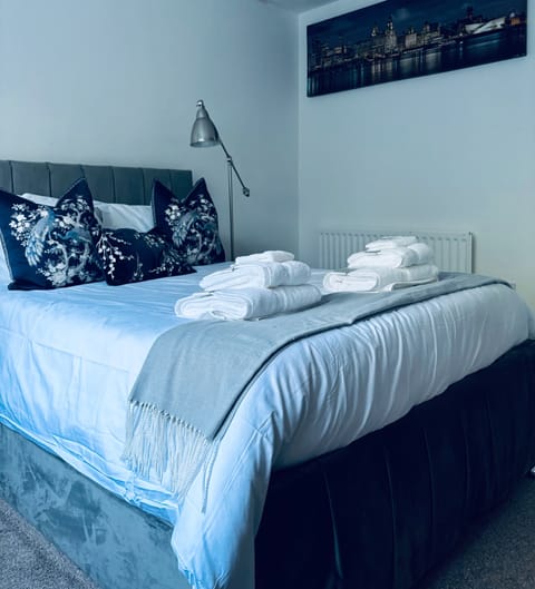 Double bed with fresh linen, wardrobes & drawers.