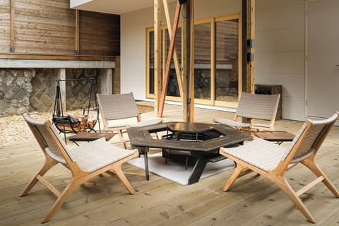 A suite-type dog base with an outdoor bonfire deck and indoor kitchen.