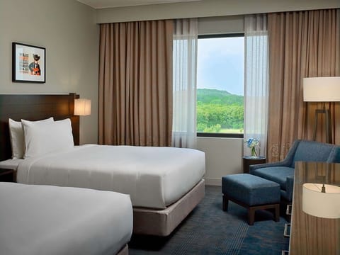 Wake up to serene views from this bright, airy room.