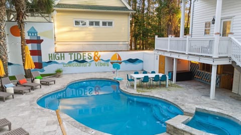 Luxury resort style backyard - Heated pool, spa, putting greens, sauna, cold plunge, fire pit, sunbathing chairs, hammock, outdoor dining, pool basketball, outdoor shower and tiki bar