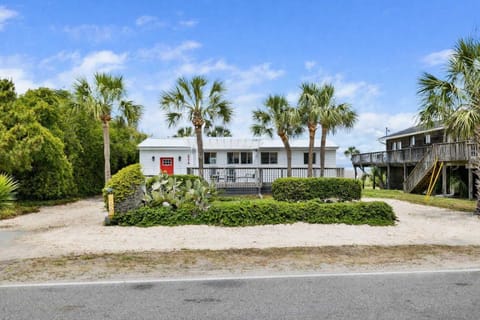 Welcome to you Folly Beach Cottage! There are endless views of both the ocean and Folly Creek from the rooftop deck! Walk to the beach located just across the street :)