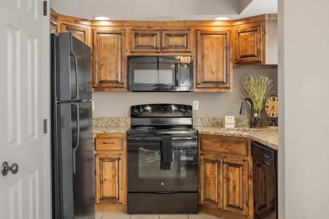 The kitchen offers ample storage & all the comforts of home