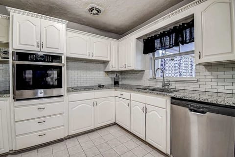 Enjoy cooking in a spacious kitchen, stocked with all the essentials for your culinary needs! #StPetersburg #KitchenGoals #VacationHome