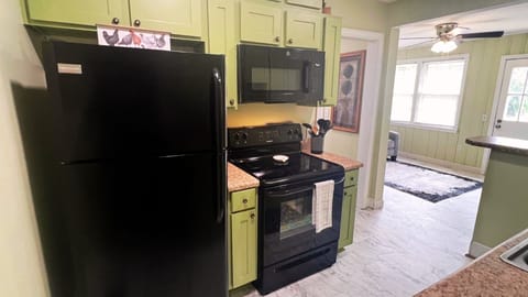 Modern kitchen with new stainless steel appliances.