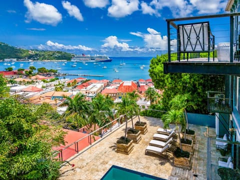 large pool and deck with sun loungers, bbq grill, and outdoor furniture - with an incredible view!