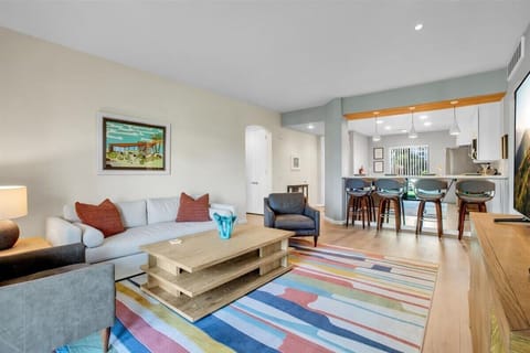 Step into our bright, open living room designed for relaxation & enjoyment. This contemporary space features ample seating, perfect for cozy gatherings or movie nights with friends or family. Sink into the plush sofa or stylish armchairs and unwind!