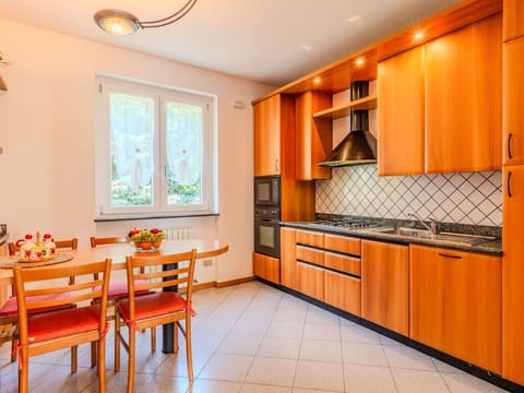 Interior Design, Wood, Kitchen, Flooring, Ceiling, Countertop, Floor, Major Appliance, Lighting, Room