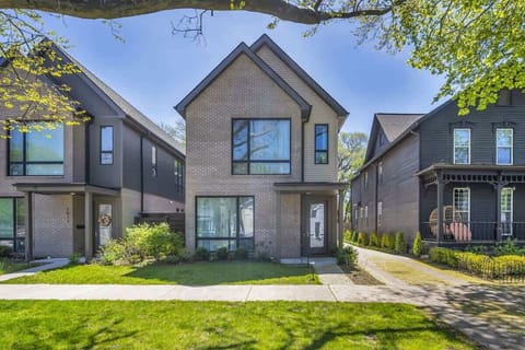 Welcome to your chic escape on Starkweather Ave in Cleveland’s vibrant heart—perfect for families or groups seeking comfort, style, and walkable fun. Shown here: a front view of our home and the shared driveway.