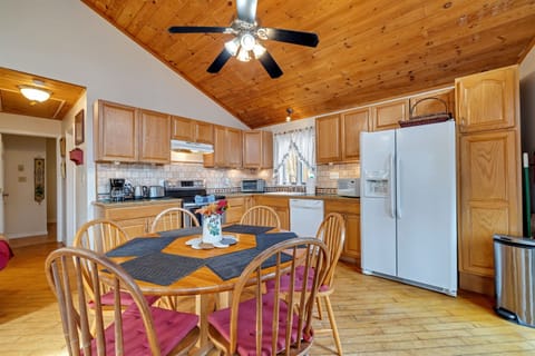 Fully stocked kitchen with large fridge, dishwasher, microwave, oven toaster, coffeemaker