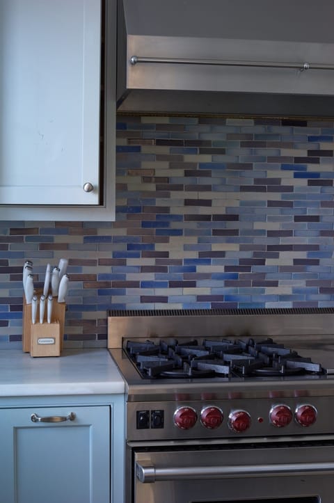 Premium stainless steel appliances, including a high-end gas range, are ready for your home-cooked meals.