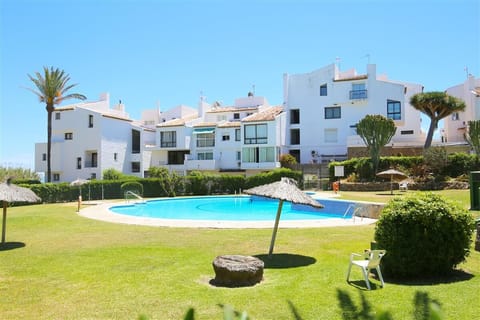 Inviting communal pool surrounded by beautiful gardens